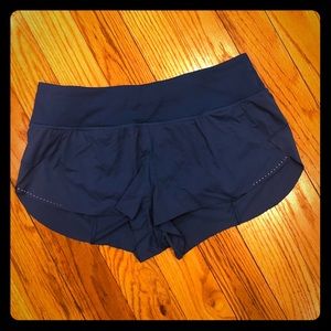 Blue and black Lululemon Speed up shorts in a 10